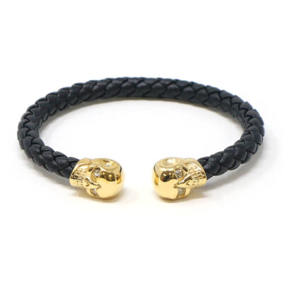 Stylish Leather Braided Gold Skull Bracelet available in sizes S, M, L, and XL. Perfect accessory for adding a unique touch to your outfit. Shop now at Ele Straps!