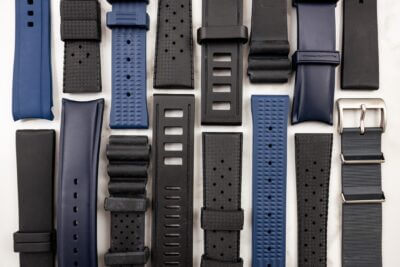 A variety of nylon and rubber watch straps in different colors and styles, arranged neatly for comparison. Ideal for exploring options for watch customization