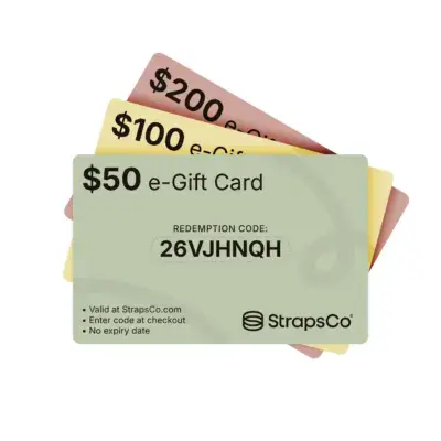 A collection of StrapsCo e-Gift Cards in various denominations: $50, $100, and $200, featuring a unique redemption code for online purchases