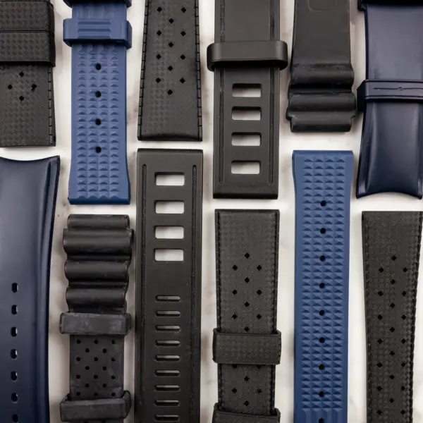 A variety of nylon and rubber watch straps in different colors and styles, arranged neatly for comparison. Ideal for exploring options for watch customization