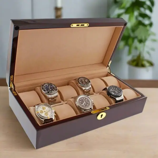 A stylish watch storage box with a glossy finish, showcasing five elegant timepieces on plush cushions, ideal for organizing and displaying a watch collection