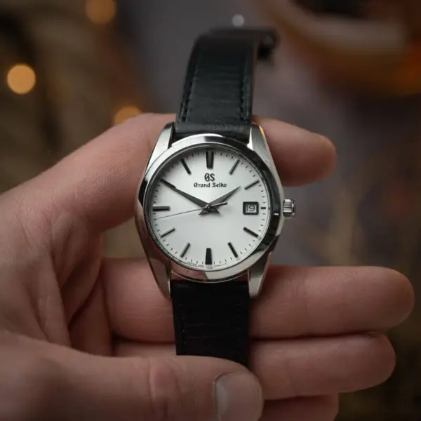 Classic Stitched Leather Strap by DASSARI showcased on a wristwatch, featuring a sleek black leather design. Available in sizes 18mm to 22mm for versatile styling